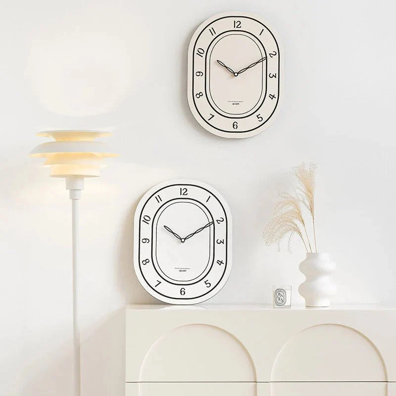 Black & White Silent Oval Wall Clock – Laser Engraved Roman Design - Tegulane Global