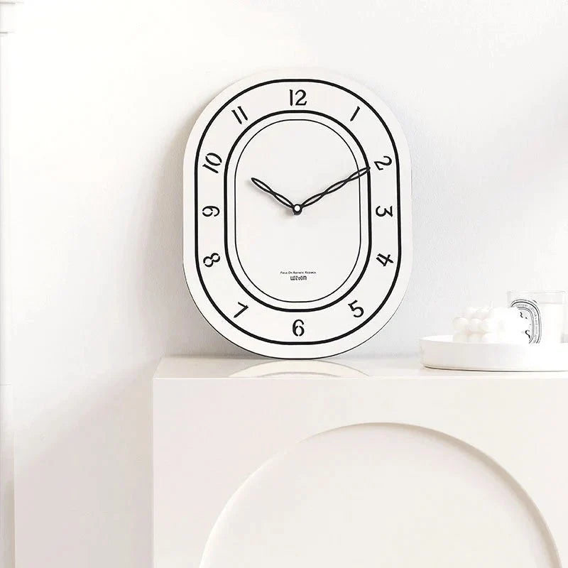 Black & White Silent Oval Wall Clock – Laser Engraved Roman Design - Tegulane Global