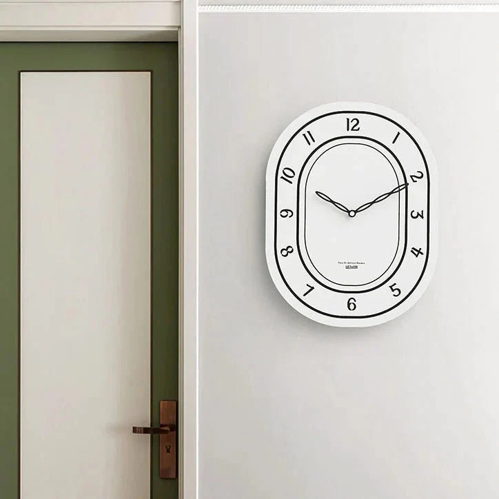 Black & White Silent Oval Wall Clock – Laser Engraved Roman Design - Tegulane Global