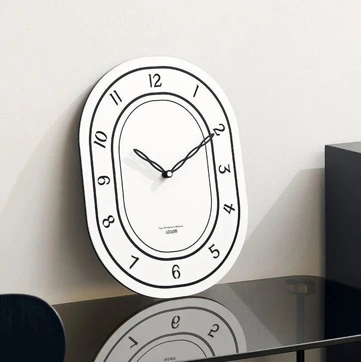 Black & White Silent Oval Wall Clock – Laser Engraved Roman Design - Tegulane Global